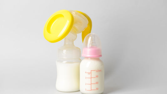 Breastfeeding bottle next to a regular baby bottle