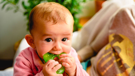 Baby chewing on a teether