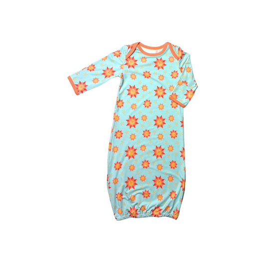 Baby gown with smiling suns pattern on baby blue background with orange trim