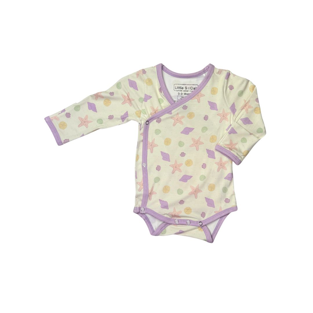 Baby onsie with starfish and seashell pattern