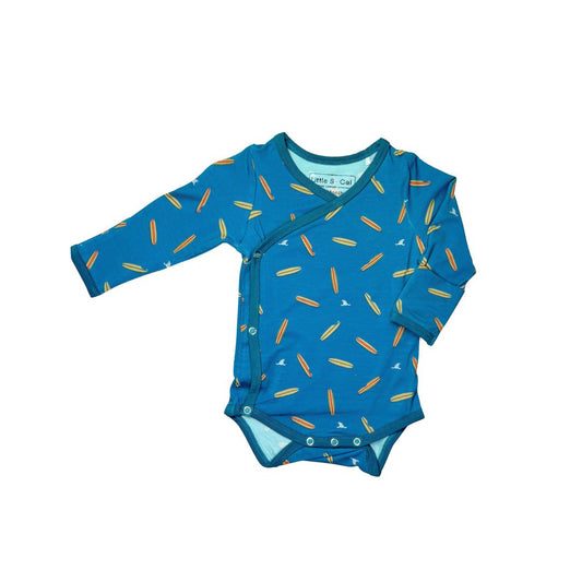 Baby onsie with surboard and shark fin pattern